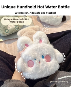 Detail of soft plush animal hand warmer featuring cute white rabbit and green frog designs