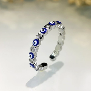 Macro detail of the evil eye ring with blue enamel and sparkling cubic zirconia stones