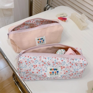 Floral and pink fabric zipper pouches with tulip labels for stationery and makeup
