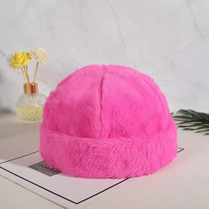 Detail of soft pink plush docker hat with warm faux fur texture and folded brim