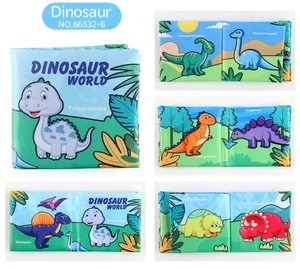 Detail of baby cloth book showing colorful dinosaur world pages and soft fabric textures