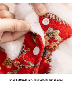 Detail of red pet tang suit with snap button closure and festive jacquard pattern