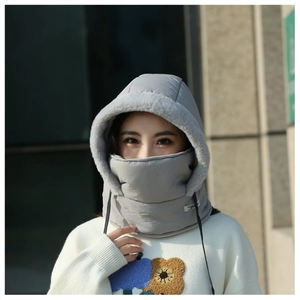 Lifestyle shot of an Asian woman wearing a grey windproof winter fleece hooded mask