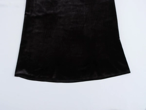 Close-up of elegant black velvet fabric showing luxury texture and soft glossy finish