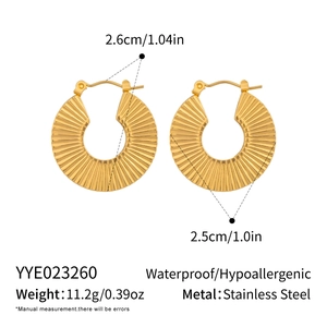 Detail view of gold pleated fan hoop earrings in hypoallergenic stainless steel