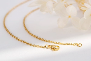 Detailed view of a gold-toned stainless steel O-chain with a durable lobster clasp closure