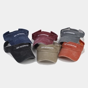 Detailed close-up of six color variations of washed cotton sun visors with embroidery