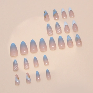 Marine-style press-on nails with 3D shell texture, gold foil accents, and French tips