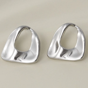 Close-up of minimalist silver oval geometric hollow earrings in 304 stainless steel