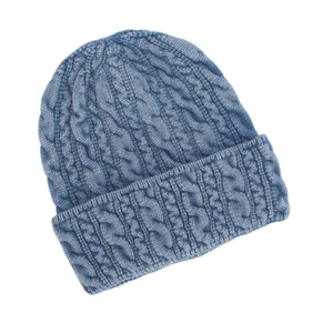 Detailed view of dark blue cable-knit pattern and ribbed cuff on the warm winter beanie