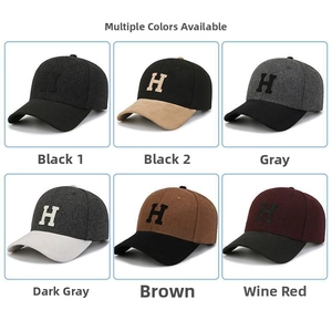 Detail view of various wool baseball caps featuring embroidered H logo in multiple colors