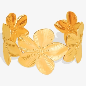Detail of 18K gold plated stainless steel bracelet with floral pattern carving
