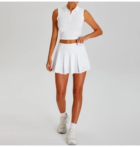 Detailed shot of white sleeveless polo top and pleated tennis skirt set for outdoor sports