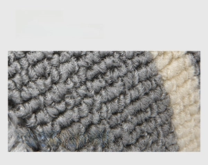 Macro detail of 3D grey and white loop pile texture for durable kitchen floor mats