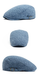 Close-up of light blue cotton linen flat cap with adjustable metal side buckle detail