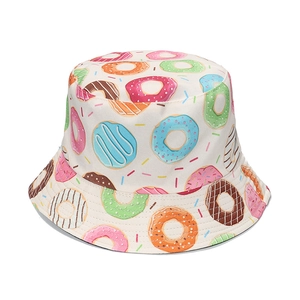 Beige canvas bucket hat with colorful donut prints for women sun protection gear