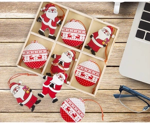 Detail view of nine-piece wooden Christmas gnome and reindeer pendants in a grid box