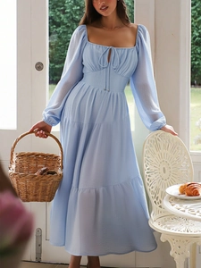 Elegant light blue long-sleeve dress with square neckline and layered ruffles details