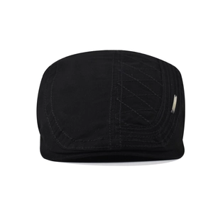 Classic black cotton newsboy cap featuring diamond quilted stitching and metal logo detail