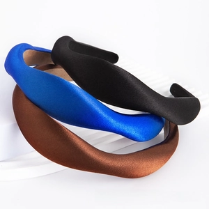 Three-piece set of solid color satin sponge headbands in blue, black, and brown colors