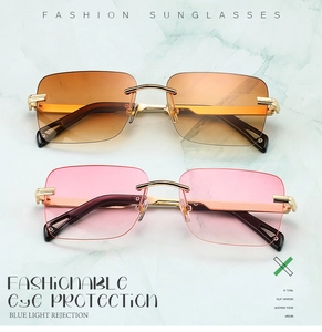 Primer plano de gafas de sol cuadradas sin montura con lentes degradados sobre mármol