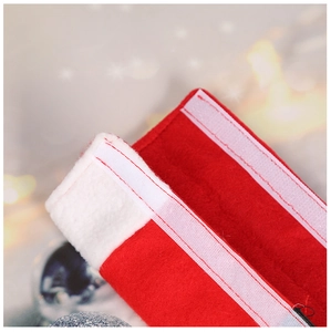 Detail showing red felt Christmas handle cover with white plush trim and velcro strap