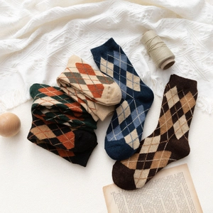 Five pairs of Japanese vintage argyle wool blend crew socks in warm autumn colors