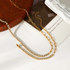 Detail of gold-plated stainless steel link chain with sparkling cubic zirconia accents