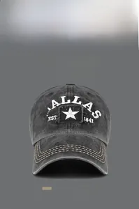 Detailed view of heavy-washed gray cotton cap with vintage Dallas embroidery and stitching