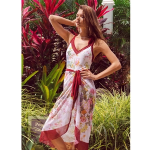 Detail of floral one-piece bikini with deep V-neck and matching printed sarong wrap