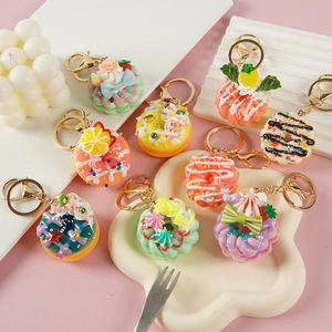 Cute artificial donut keychains in various colors with decorative cream and sprinkles