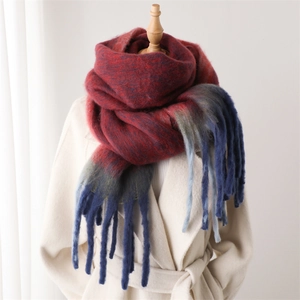 Detail of color-block gradient scarf with thick tassels and warm faux cashmere texture