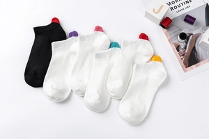 Detail of cotton ankle socks featuring colorful embroidered hearts on the heels