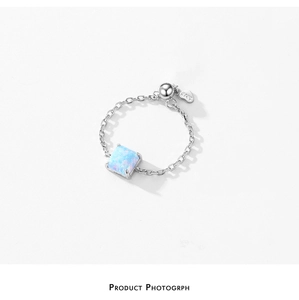 Detailed close-up of S925 sterling silver chain ring with square blue opal gemstone