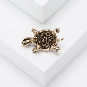 Detailed back view of vintage turtle brooch showing secure pin clasp and metal texture