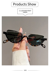 Side view of leopard print semi-rimless sunglasses with dark green lenses in hand