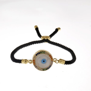 Bracciale occhio del male dorato con zirconi colorati e cordino nero intrecciato