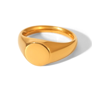 Macro shot of 18k gold plated round signet ring with a polished mirror finish surface