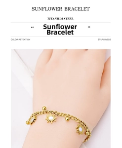 Close-up of titanium steel sunflower bracelet with gold beads worn on a wrist