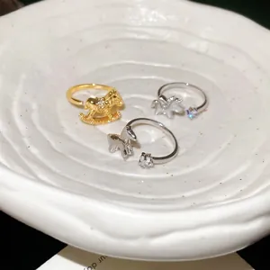 Star zircon rocking horse open ring in gold and silver finish with crystal details