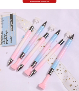 Close-up of six macaron gradient nail art dotting pens with metallic tips and gift decor