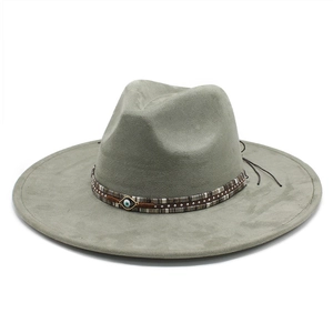 Sage green suede fedora with Bohemian patterned band and evil eye charm accessory