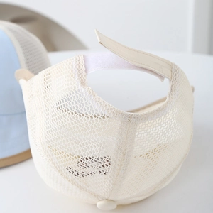 Detail of infant sun hat showing breathable mesh fabric and adjustable velcro strap