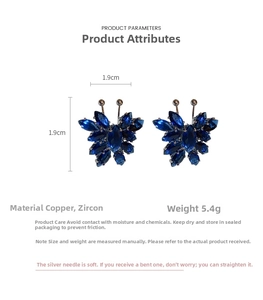 Detailed view of blue zircon butterfly earrings with silver pins measuring 1.9cm