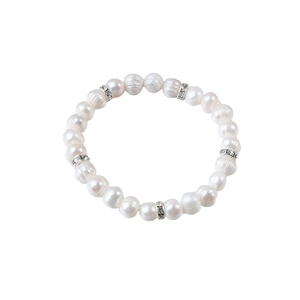 Elastic natural freshwater pearl bracelet with sparkling rhinestone spacer beads on white background