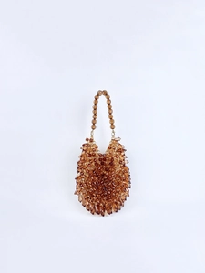 Close-up of handmade brown acrylic beaded handbag with faceted crystal-like texture