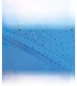 Macro shot of breathable mesh perforations and reinforced stitching on blue sports cap