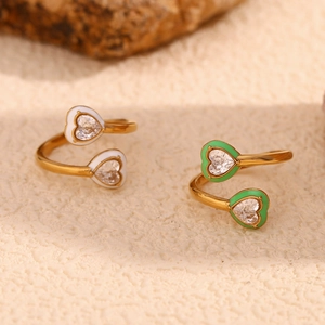 Detail view of 18K gold plated heart rings with colorful enamel and zircon stones