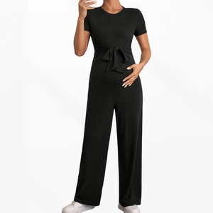 Elegant black short sleeve wide leg jumpsuit with high waist ribbon tie and ribbed fabric