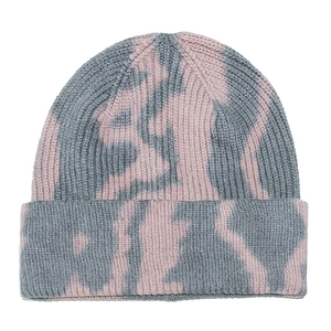 Close-up of pink and grey tie-dye knitted beanie showing thick ribbed texture and soft fabric